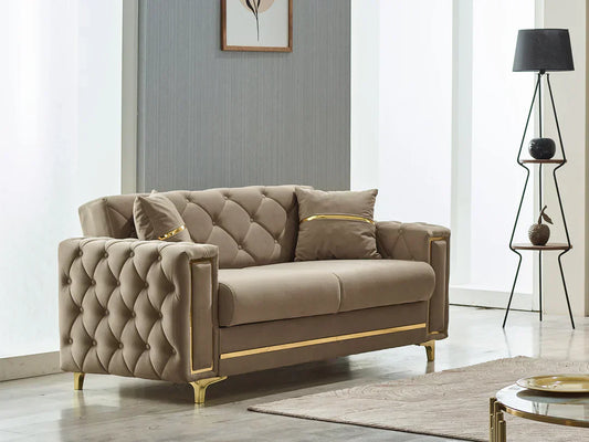 Tufted taupe loveseat with gold trim in a modern living room